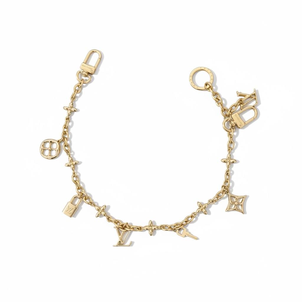 Louis Vuitton Gold Bag Charm – Iconic LV Monogram Accessory ✨💛
