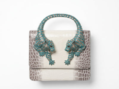 white and grey croc-print top-handle bag with turquoise crystal tiger-head hardware