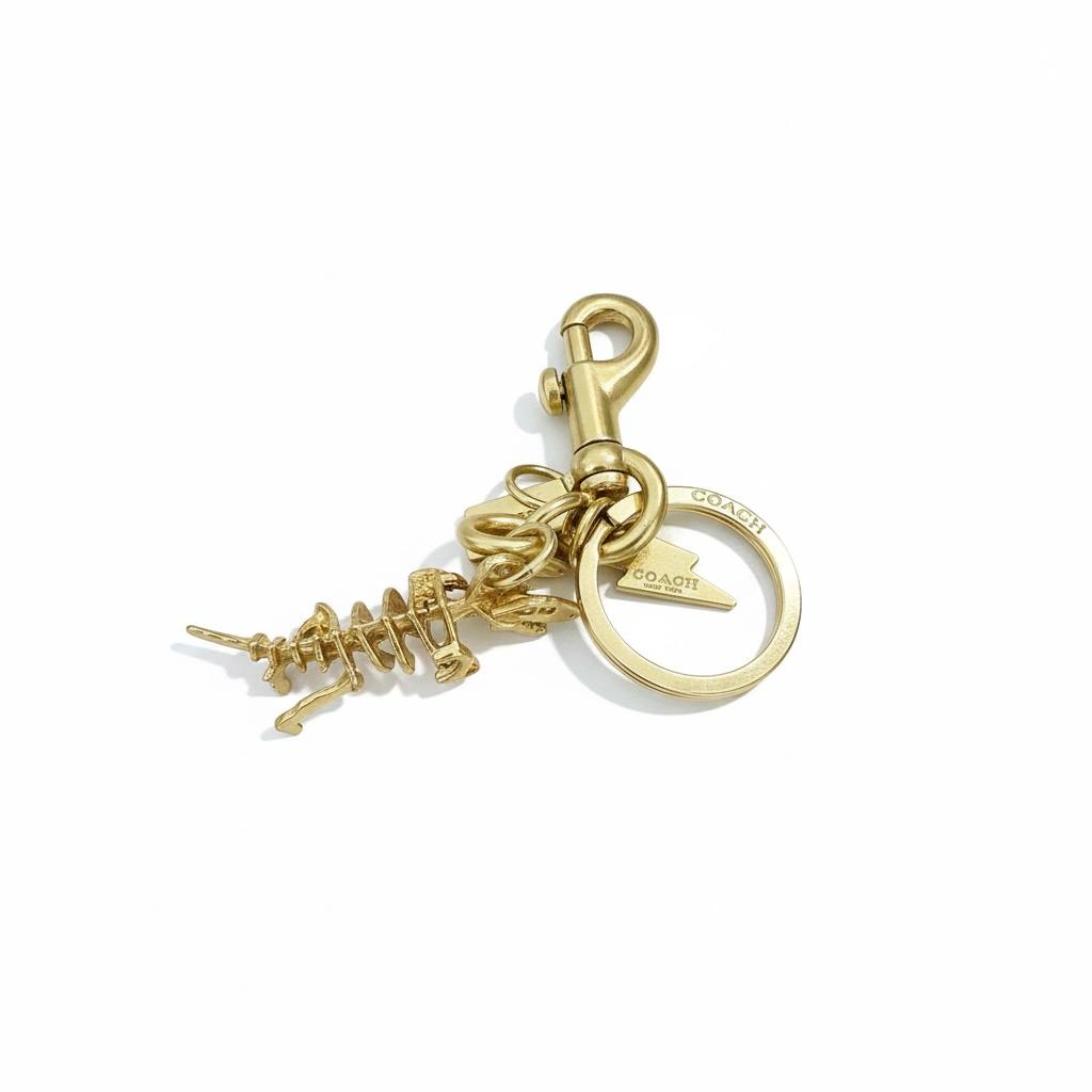 💛 Coach Rexy Gold Dinosaur Keychain – Iconic Designer Charm