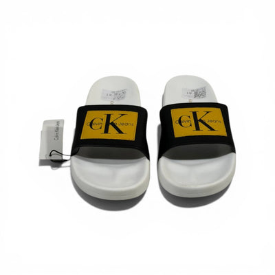 CALVIN KLEIN Luxury Black & White Slide Sandals – Yellow CK Logo Patch & Modern Street Style 👟✨