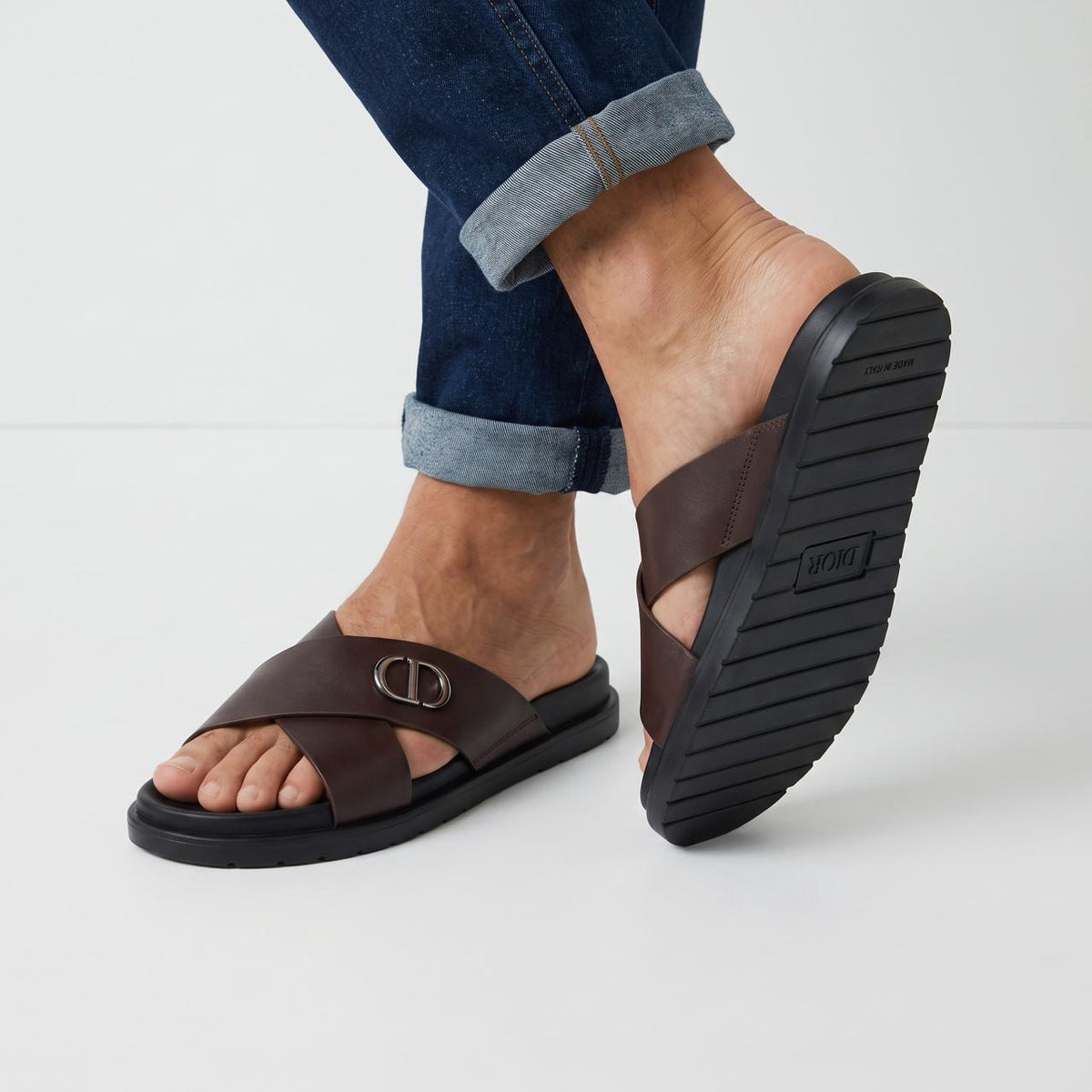 Dior men's brown cross-strap slides with CD logo and black sole