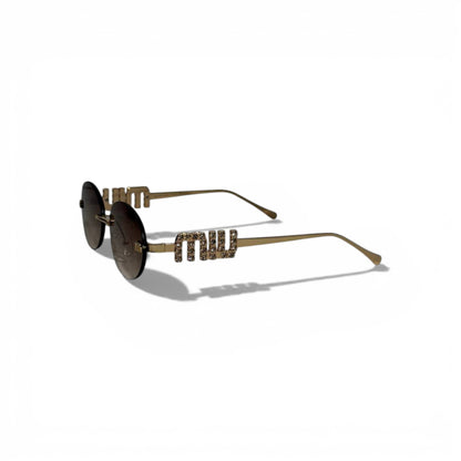 🕶️ MIU MIU Oval Sunglasses – Gold Metal Frame with Crystal Temple Detail 🕶️