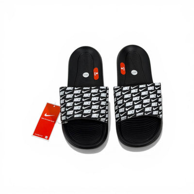 ⚫⚪ Nike All-Over Logo Slides – Streetwear Statement Edition