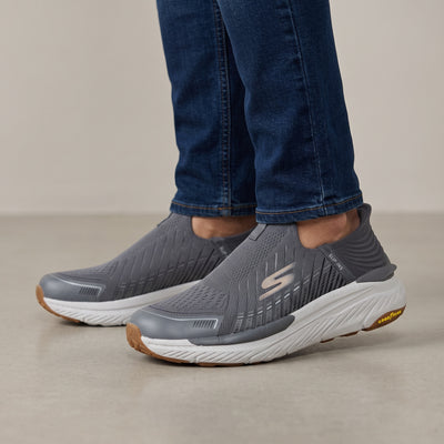 Grey Skechers slip-on knit trainer with white midsole and Goodyear gum outsole