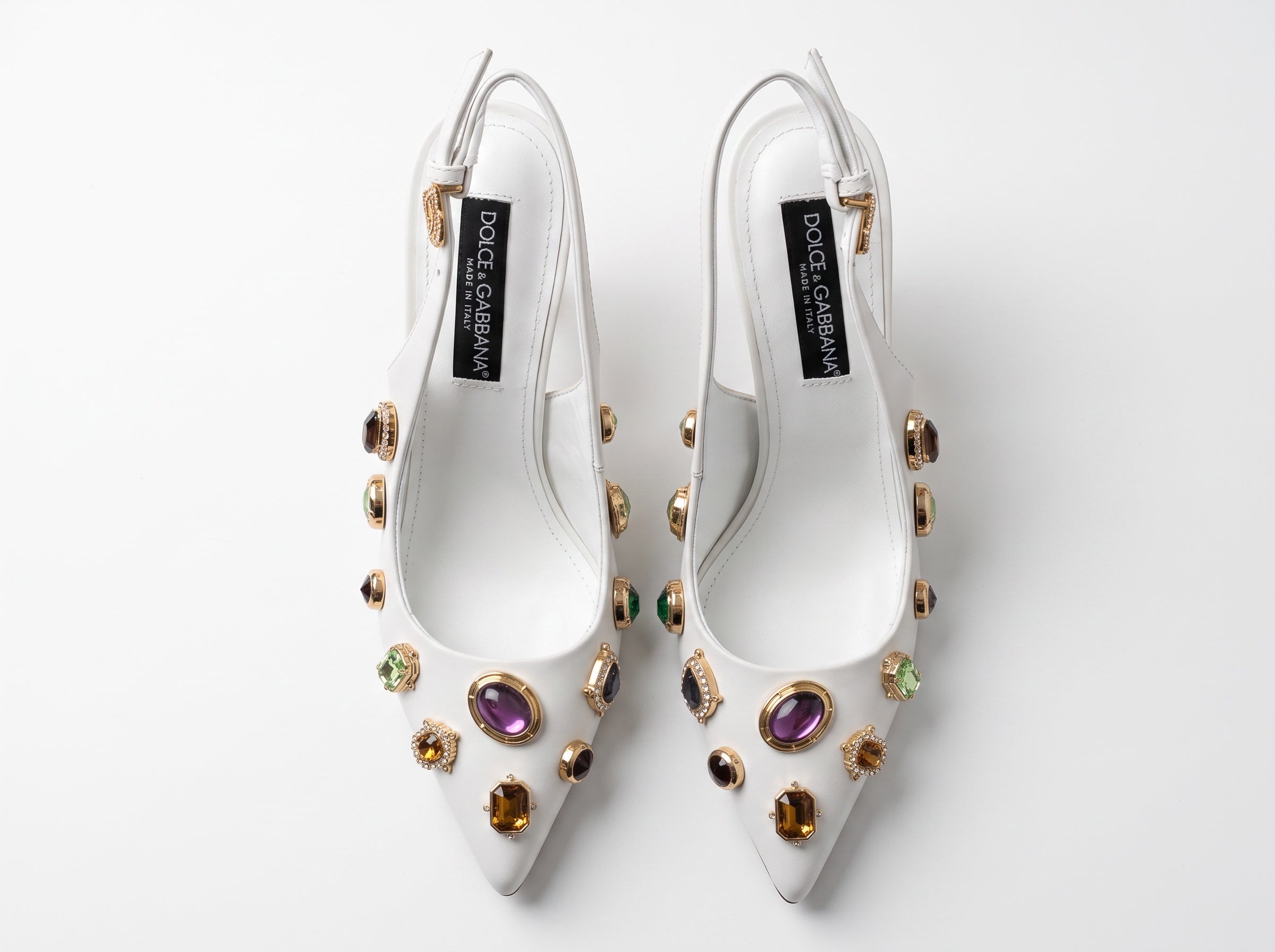 White Dolce & Gabbana slingback heels with jeweled embellishments and gold sculptural heels