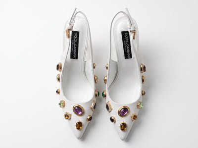 White Dolce & Gabbana slingback heels with jeweled embellishments and gold sculptural heels