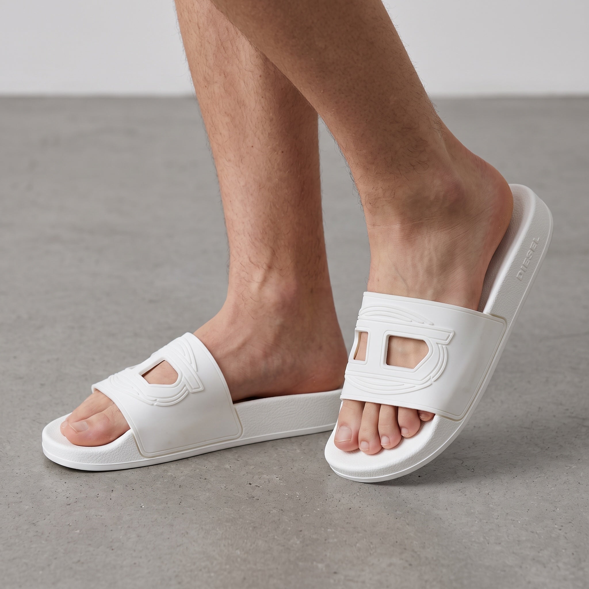 White Diesel slide sandal with cut-out logo on strap