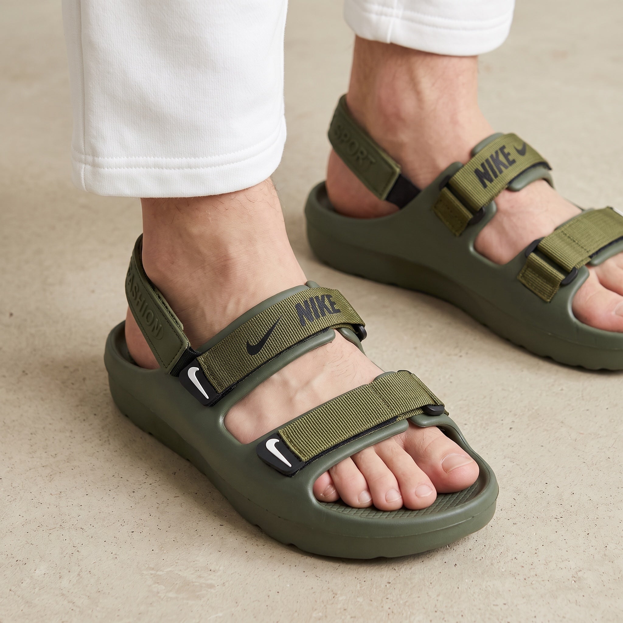 Nike olive green men's sport sandals with adjustable webbing straps and chunky molded sole