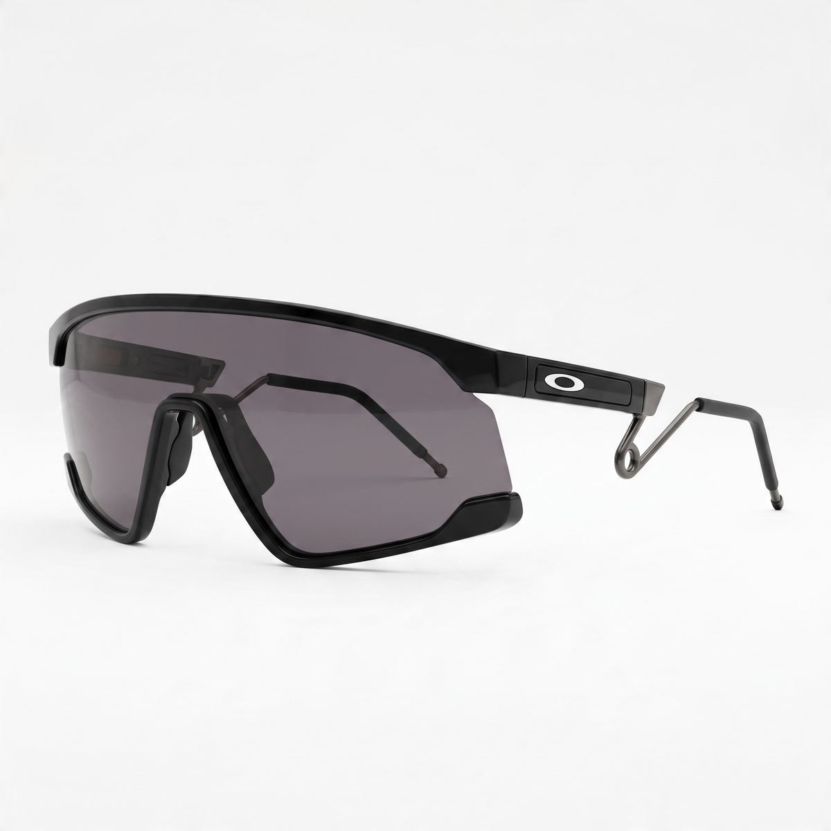 Oakley black shield sunglasses with grey lens and Oakley logo on the temple