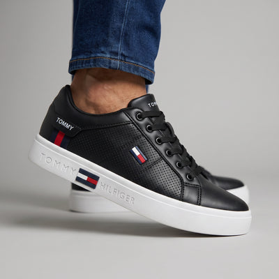 Tommy Hilfiger black low-top court sneakers with white cupsole and flag detail