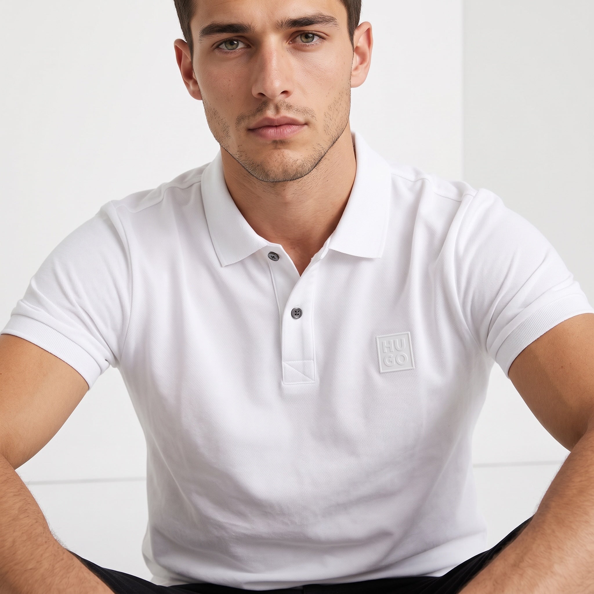 White Hugo short-sleeve polo with embossed logo on chest