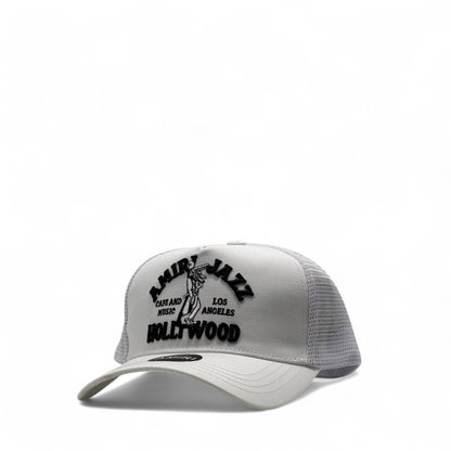 Amiri Jazz Café Hollywood Trucker Cap – White & Black 🕊️🎷