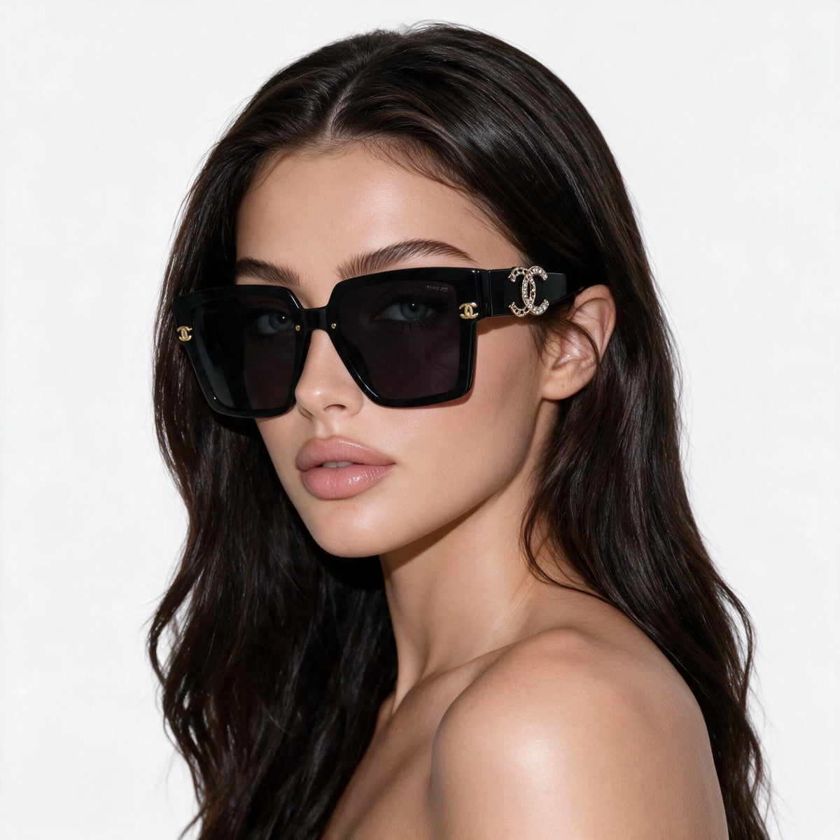 Chanel oversized black shield sunglasses with gold CC logo on temple