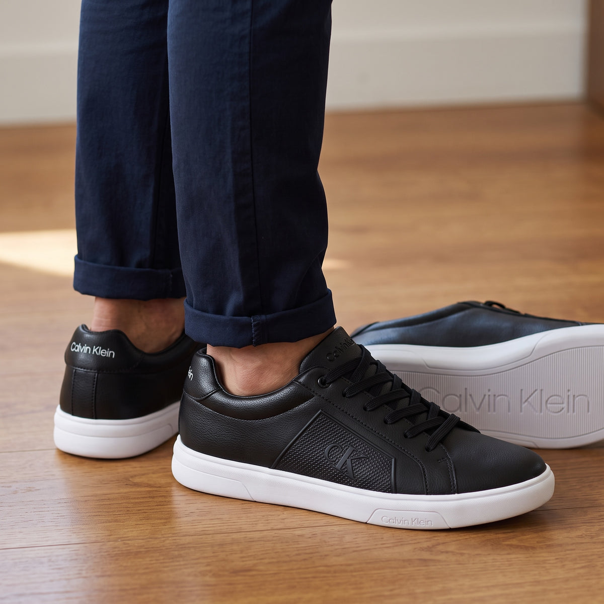 Calvin Klein black low-top sneakers with white sole and CK logo