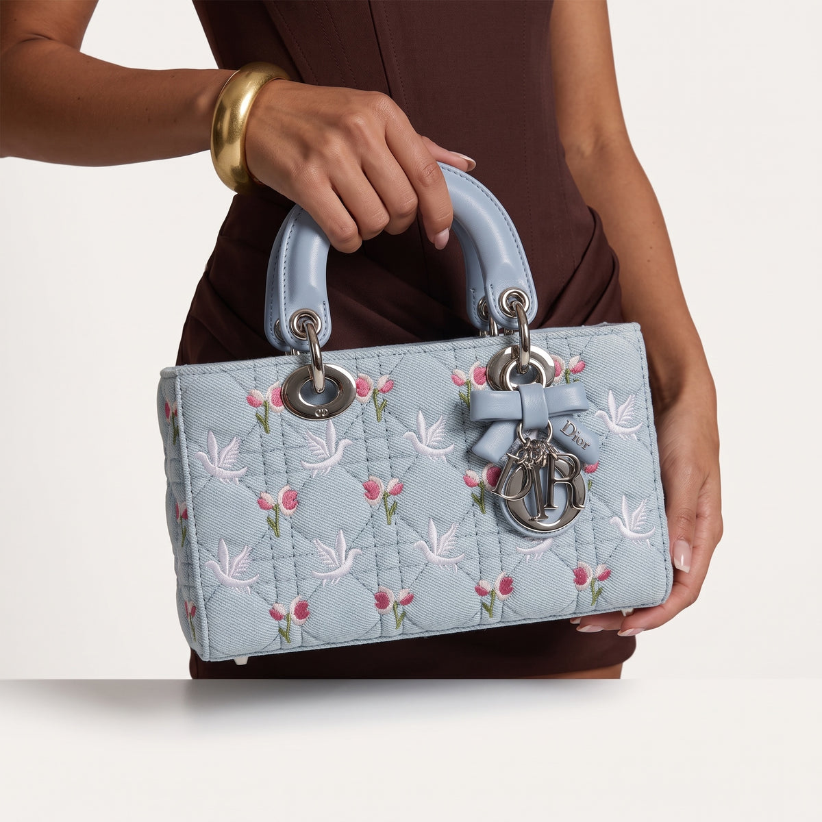 Light blue Dior Lady Dior top-handle bag with floral and dove embroidery and silver charms