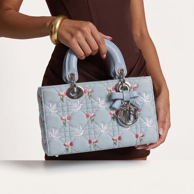 Light blue Dior Lady Dior top-handle bag with floral and dove embroidery and silver charms