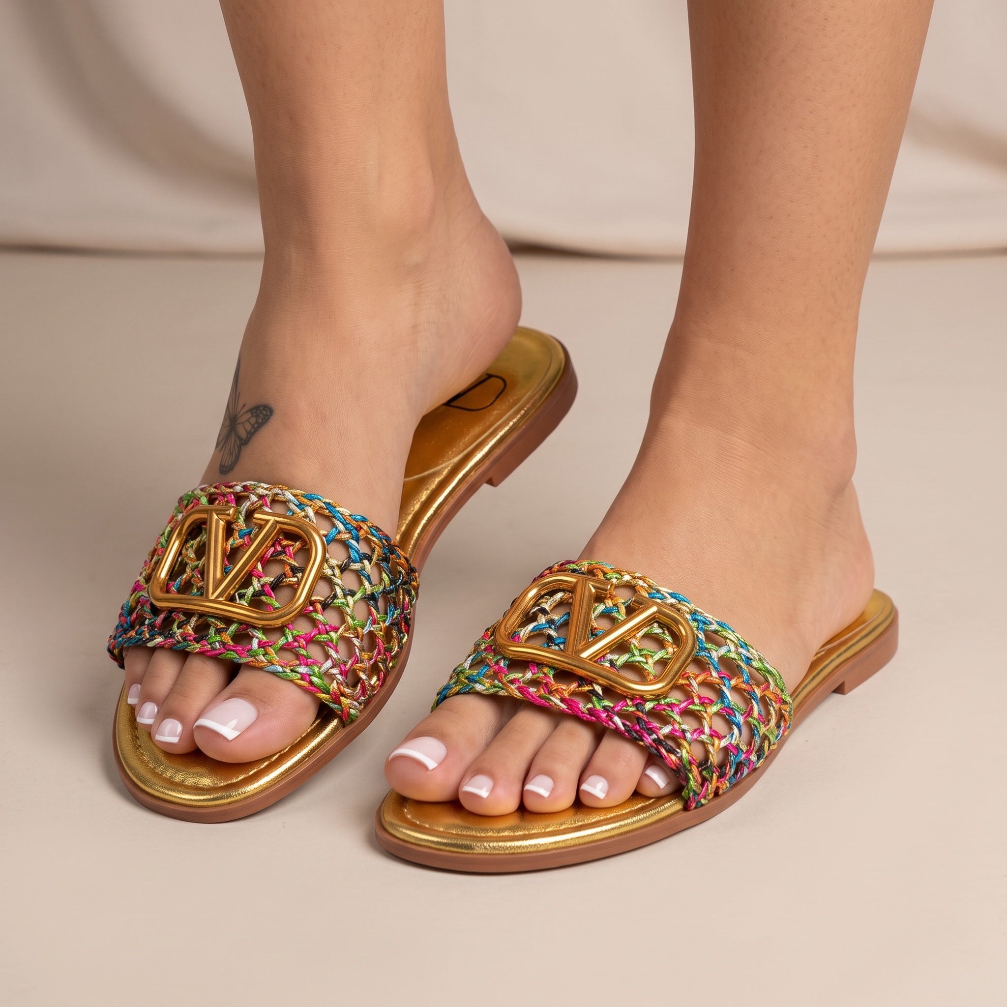 Valentino multicolor braided slides with gold V logo on gold footbed