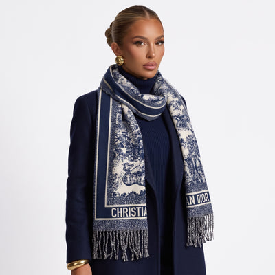 Navy and ivory Dior jacquard scarf with toile motif and fringed ends draped over model