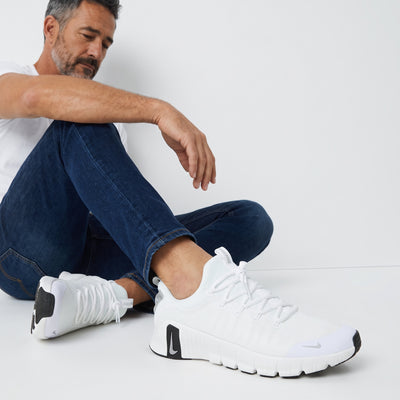 White Nike chunky trainers with sculpted sole and black tread