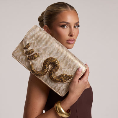 gold metallic envelope clutch with raised gold snake hardware