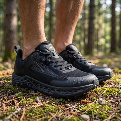 Altra black trail running shoes with Vibram outsole shown on feet