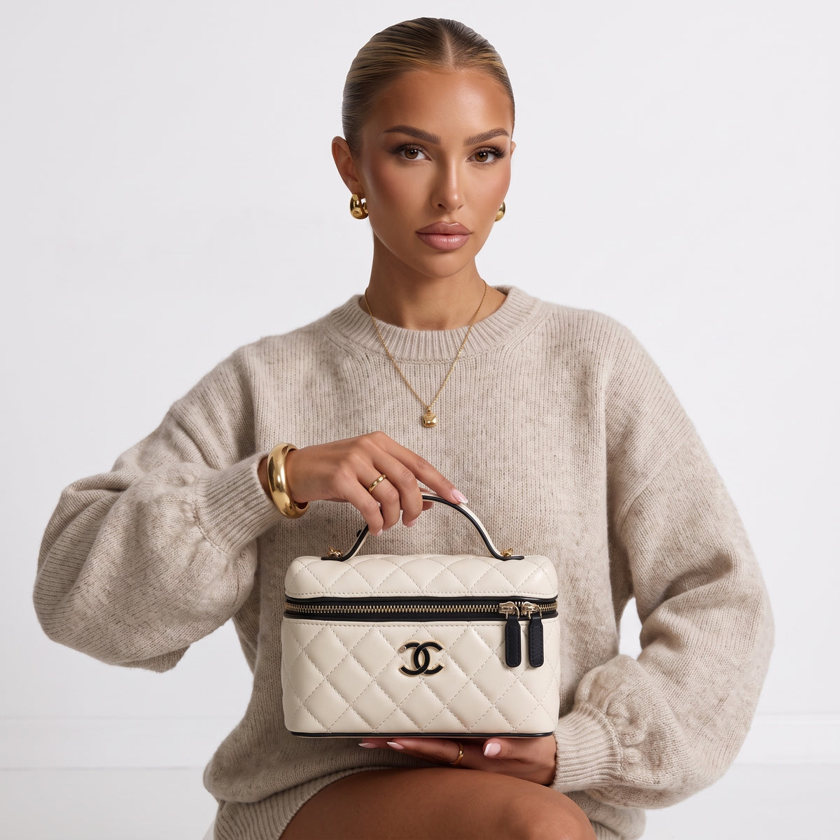 Chanel cream quilted vanity case with black trim and gold CC logo