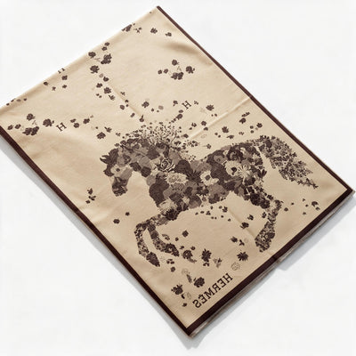 Hermès brown floral shawl with fringed edges folded and draped