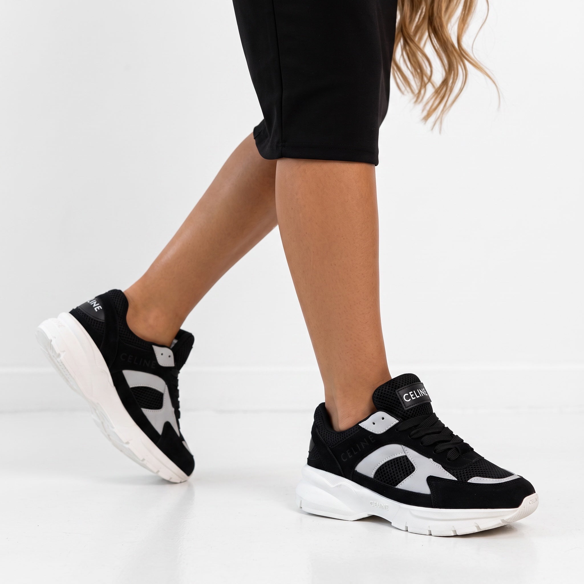Celine black and white chunky sneakers on model