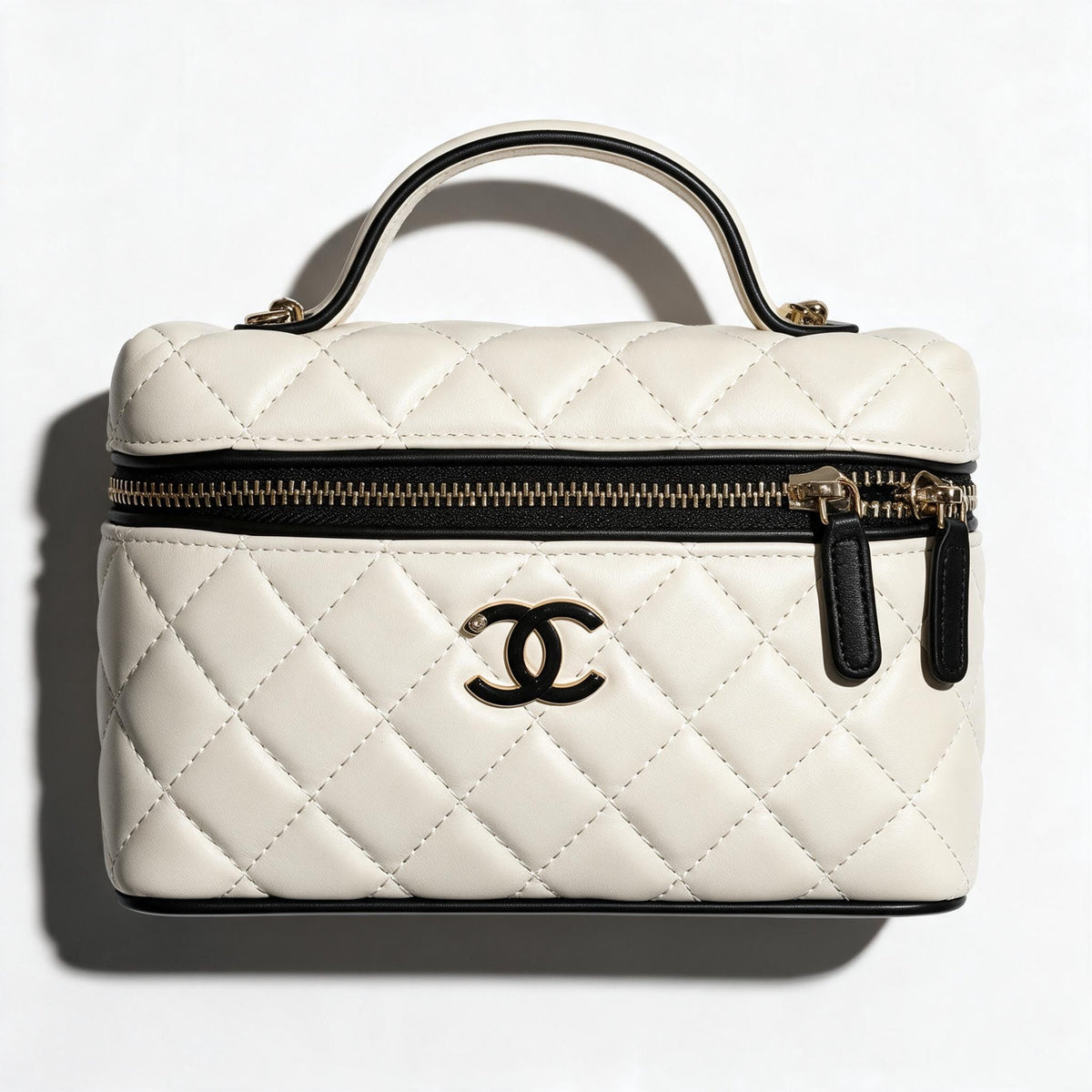 Chanel cream quilted vanity case with black trim and gold CC logo