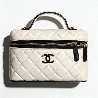Chanel cream quilted vanity case with black trim and gold CC logo