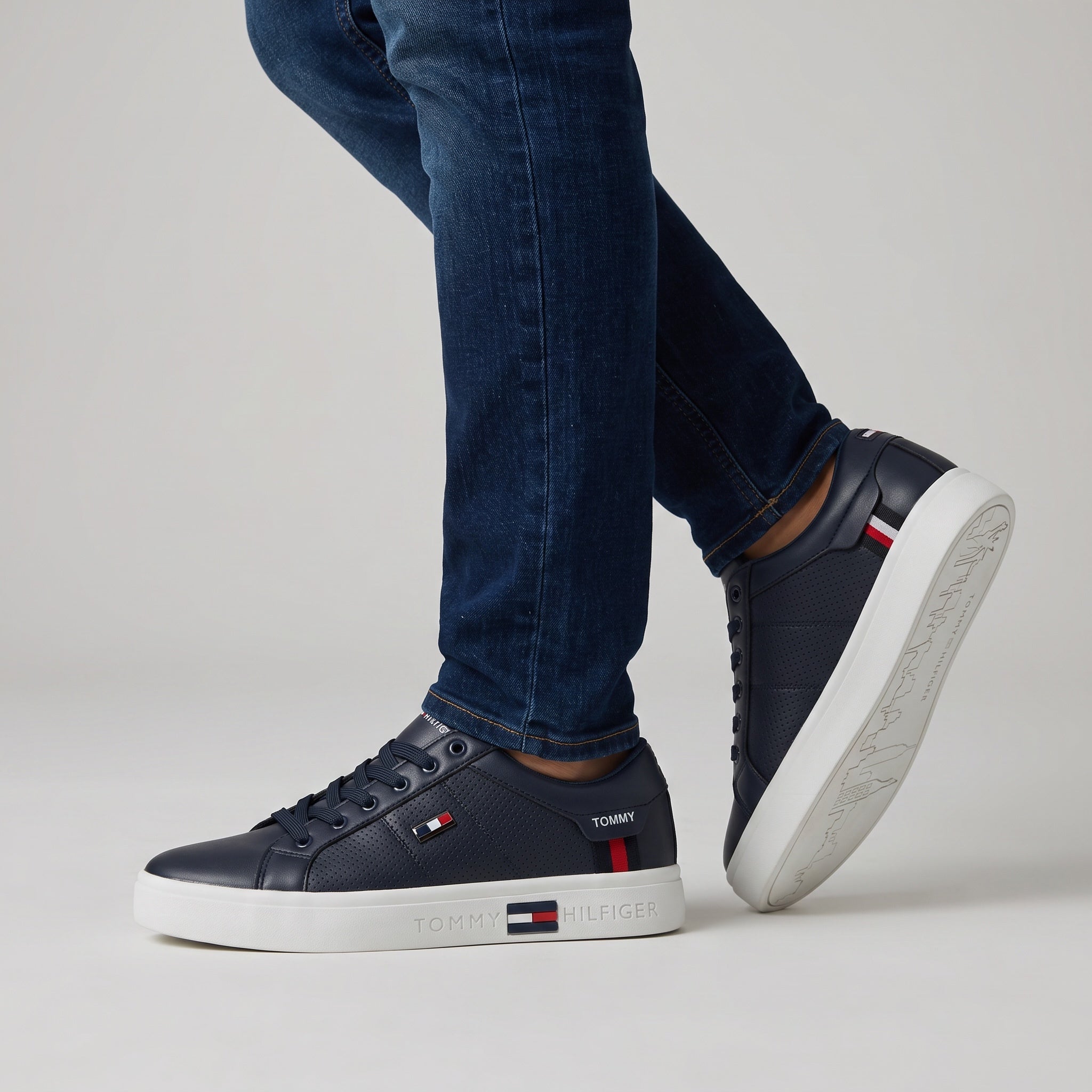 navy Tommy Hilfiger low-top sneakers with white platform sole and logo accents