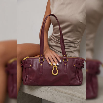 burgundy leather tote bag with gold hardware and double handles