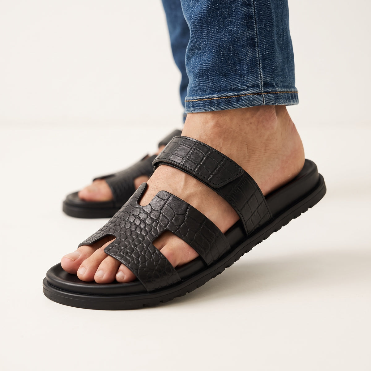 Hermès black croc-embossed men's slide sandal with adjustable ankle strap and chunky sole