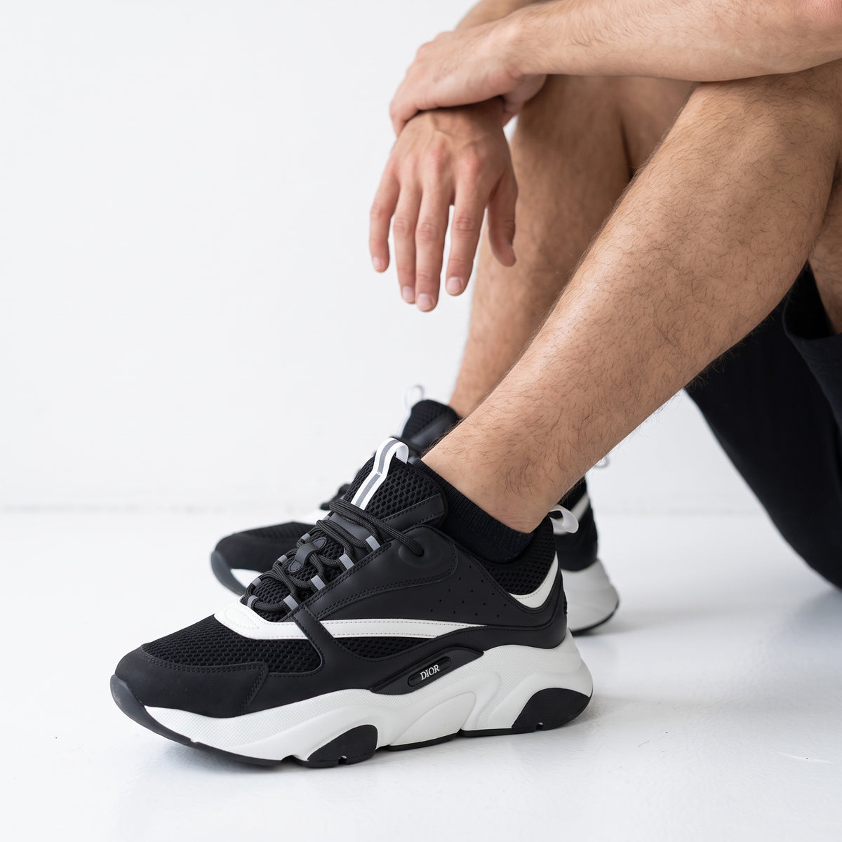 black and white Dior B22 chunky sneakers with mesh panels and sculpted sole