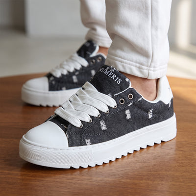Numeris black distressed platform sneakers with white chunky sole and wide laces
