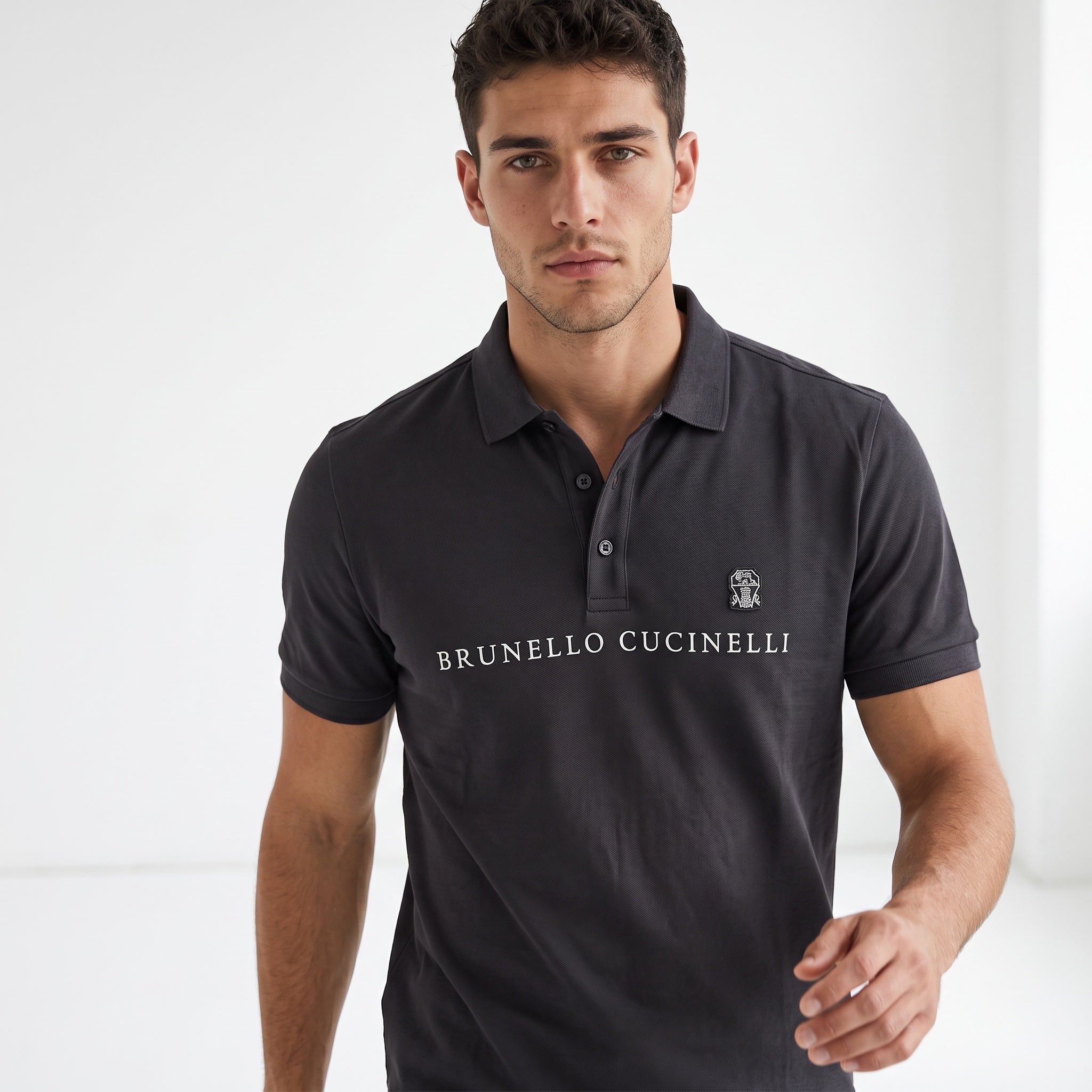 Brunello Cucinelli charcoal polo with chest logo and embroidered crest