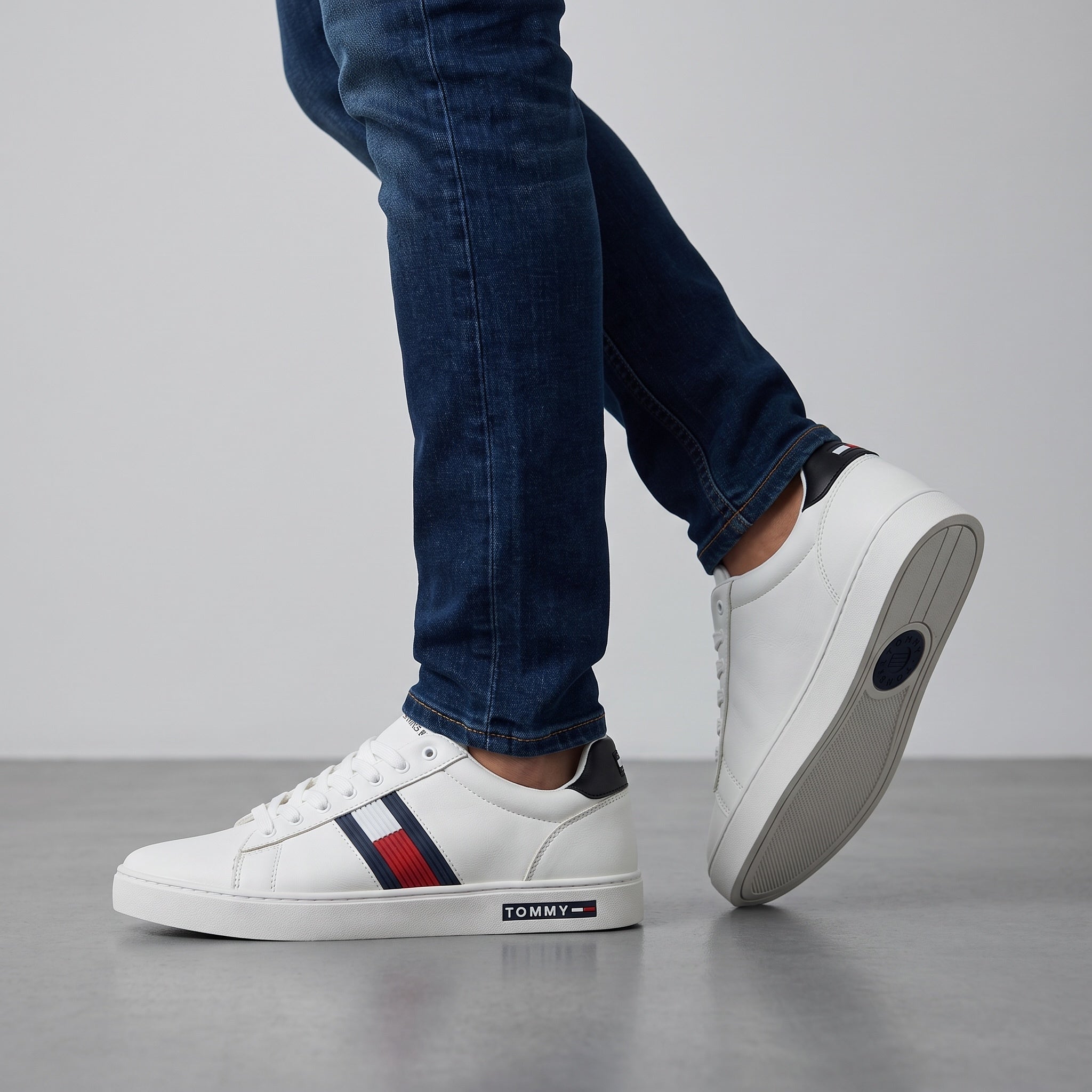 white Tommy Hilfiger low-top sneaker with navy and red stripe and branded midsole