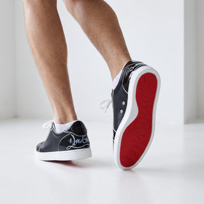 Christian Louboutin black low-top sneakers with red soles and white piping