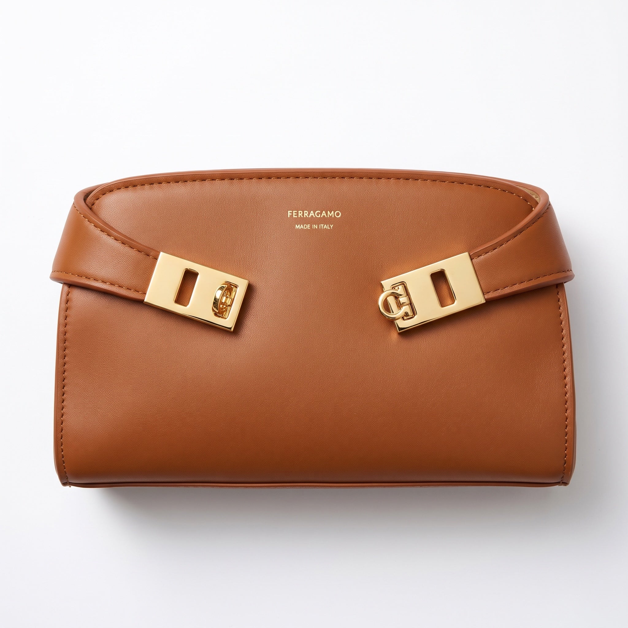 Ferragamo tan leather bag with gold Gancini hardware and visible Made in Italy logo