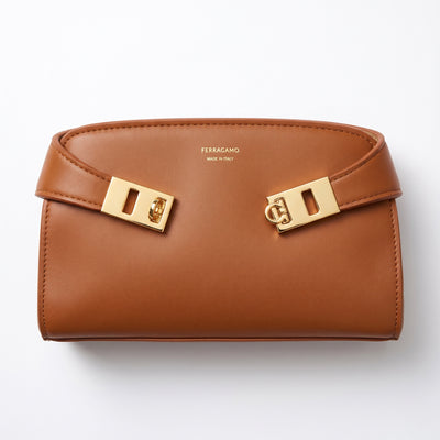 Ferragamo tan leather bag with gold Gancini hardware and visible Made in Italy logo