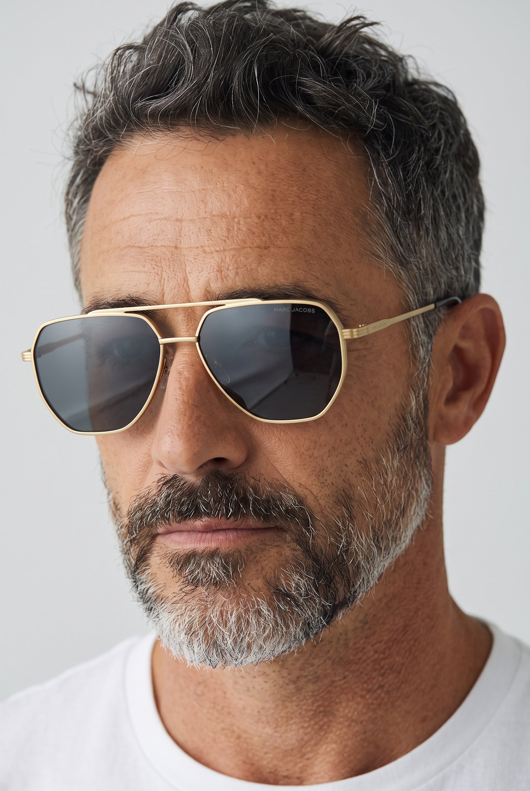 Marc Jacobs gold-tone geometric aviator sunglasses with dark lenses on male model