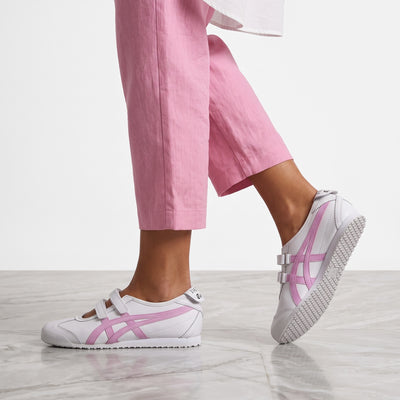 White Onitsuka Tiger trainers with pink side stripes and velcro straps