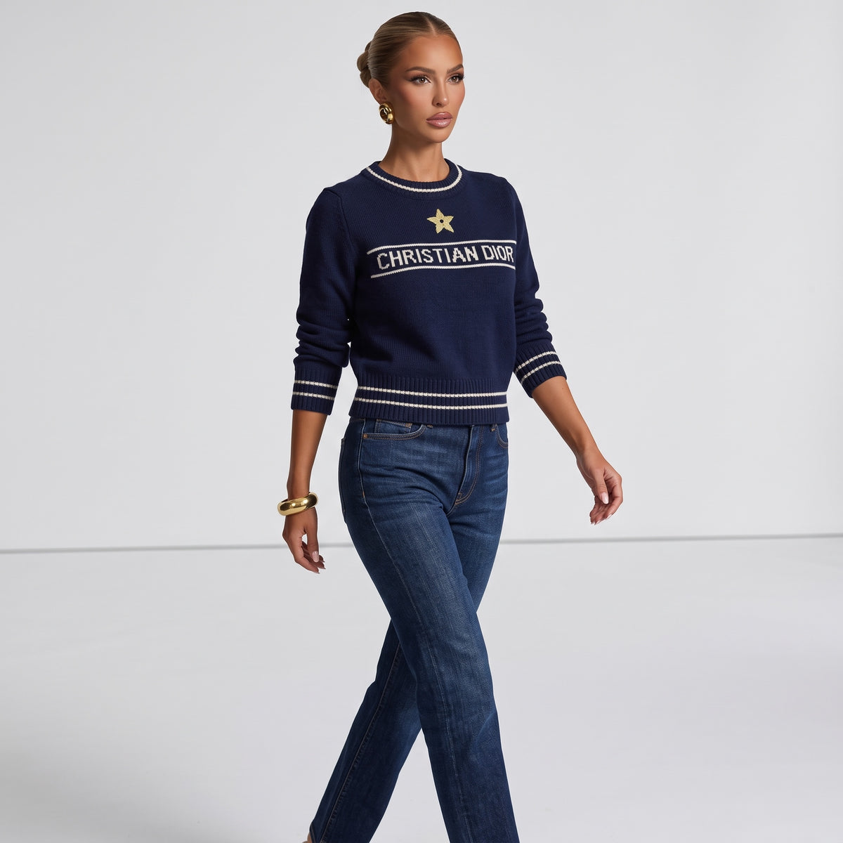 Christian Dior navy crew neck sweater with white logo band and gold star