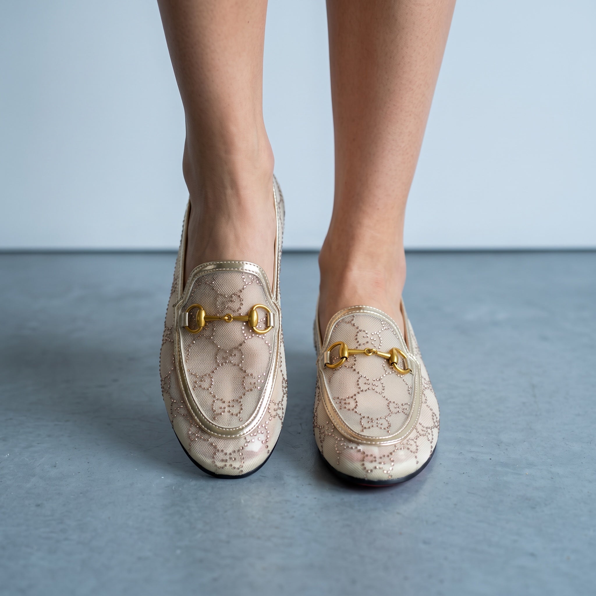 Gucci beige mesh horsebit loafers with gold trim and GG pattern