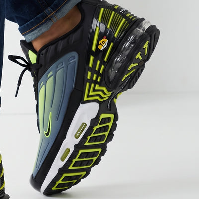Nike Air Max Plus blue to green gradient sneakers with neon accents