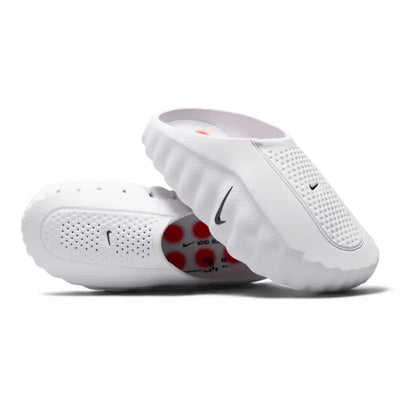 White Nike slip-on clog with perforated upper and red circular outsole pods