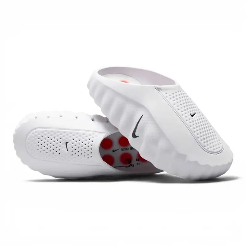 White Nike slip-on clog with perforated upper and red circular outsole pods