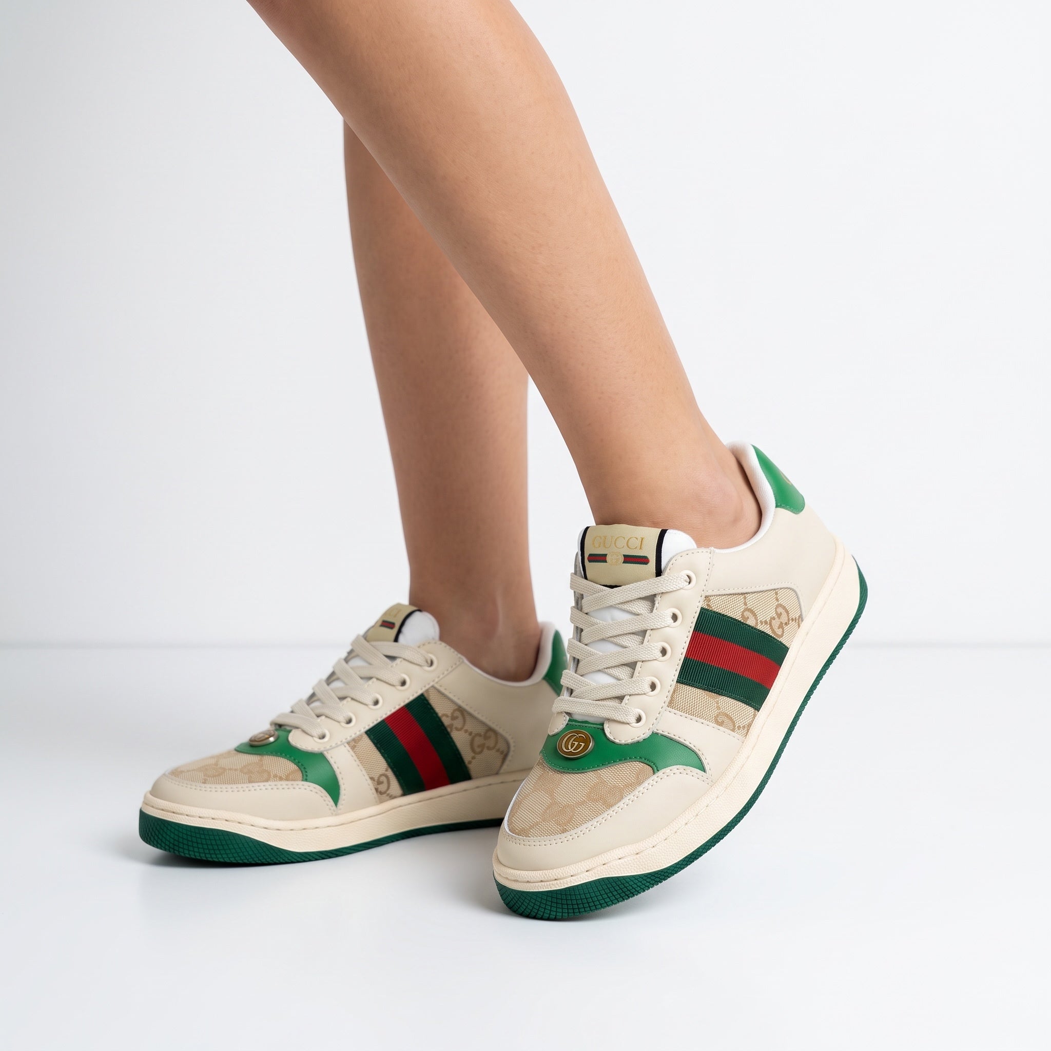 Gucci beige low-top sneakers with green-red web and monogram panels