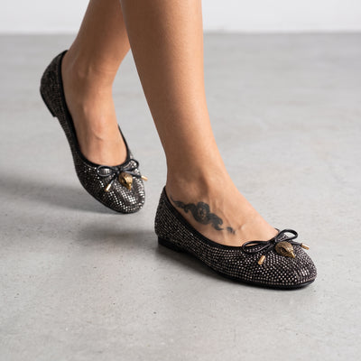 black crystal-embellished ballet flats with gold-tone charm at toe