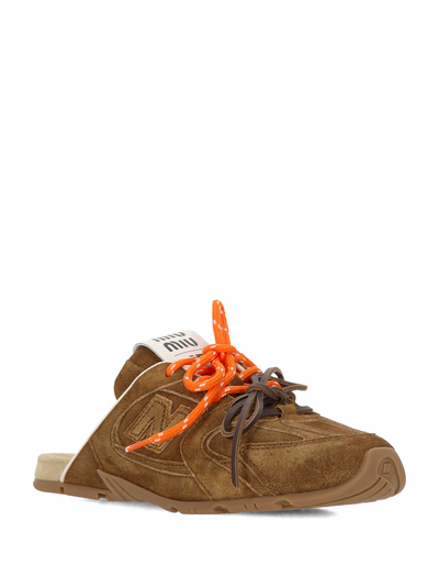 brown suede Miu Miu open-back mule sneaker with orange laces and branded tongue